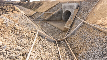 Construction of a drainage ditch along a road with a culvert under the road