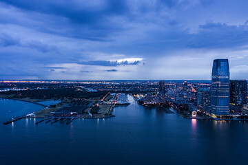 Aerial view of Jersey City Skyline with Morris Canal Park at Dusk. 
