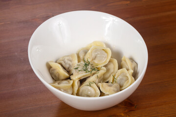 Russian traditional dumplings in the bowl