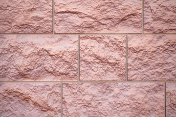 The texture of decorative bricks for finishing the facade of a house with a bronze shade