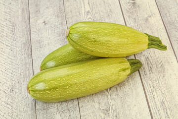 Young tasty zucchini over board