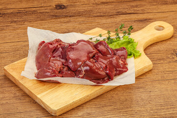 Raw chicken liver over board