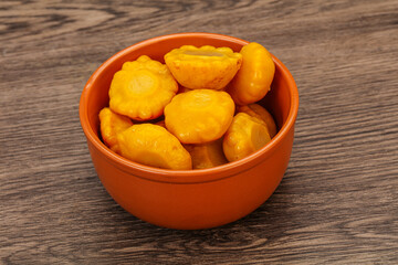 Marinated yellow patisson in the bowl