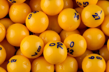 Pile of Yellow Numbered Bingo Balls