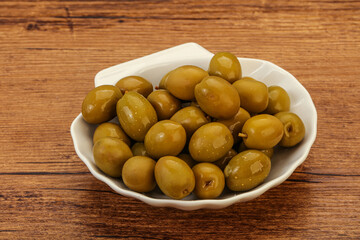 Green pickled olives in the bowl