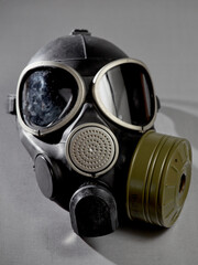 Black gas mask on a gray background