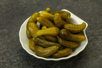 Pickled gherkin in the bowl