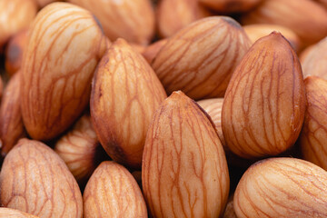 Almond beans soak in water overnight to get the most benefits before  to made almond milk, Health food with good fats and down aging, Antioxidants and lower cholesterol levels, Selective focus.