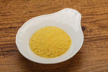 Raw cous cous heap in the bowl