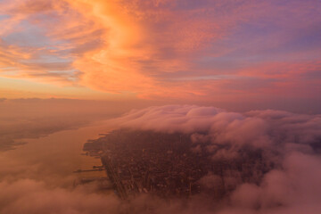 Aerial view of New York City skyline at sunset with both midtown and downtown Manhattan from Hudson river 