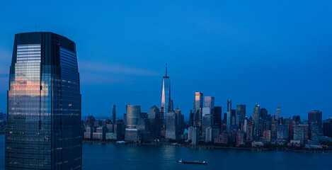 Fototapeta na wymiar Aerial view of lower Manhattan at dusk from Hudson river. 