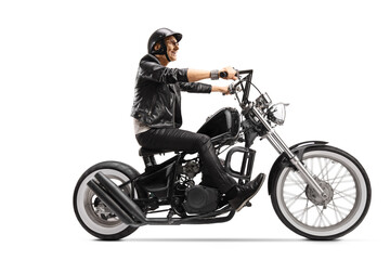 Fototapeta na wymiar Cool elderly biker riding a customized chopper motorbike