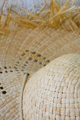 A summer straw hat with fringes