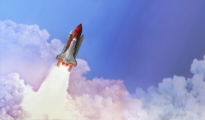 Space shuttle in the blue sky with cloud. Launch of spaceship. Space wallpaper. Elements of this image furnished by NASA