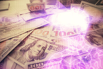 Double exposure of man wearing VR glasses drawing over usa dollars bill background. Concept of virtual reality.