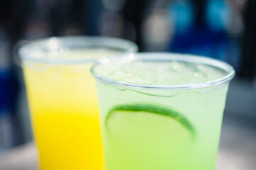 ice cold lime drink and orange drink outdoor