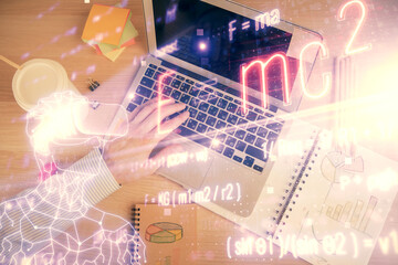 Double exposure of man's hands typing over computer keyboard and formula hologram drawing. Top view. Education concept.