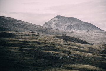Panoramic view of the valley near the highest mountain peak of Paps of Jura (Beinn an Òir) under...