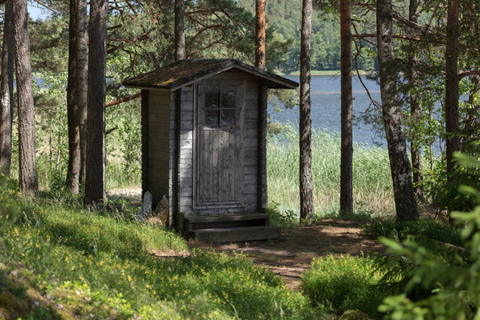 Public toilet (wooden building) in the forest. Finland.