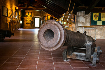 Cannon in one of room in the Nehaj castle, a fortress on the hill Nehaj in the town of Senj, Croatia, 28th April 2015.