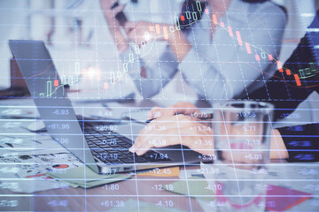Multi exposure of woman hands typing on computer and forex chart hologram drawing. Stock market analysis concept.