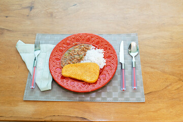 Brazilian food with rice and beans.