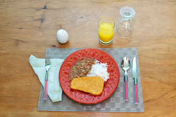 Brazilian food with rice and beans.