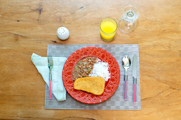 Brazilian food with rice and beans.