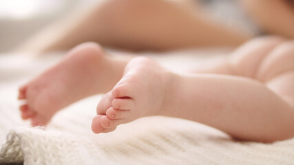 Obraz na płótnie Canvas Close up shot of little baby feet. Selective soft focus. High quality 4k footage