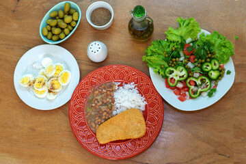 Brazilian food with rice and beans.