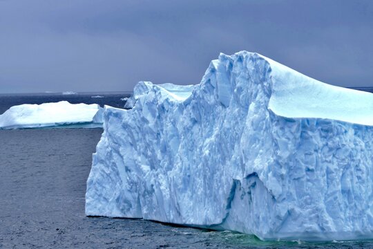 Iceberg closeup with interesting wave structure and blue ice, Antarctica