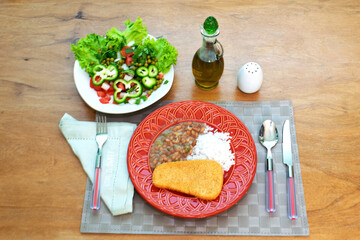 Brazilian food with rice and beans.