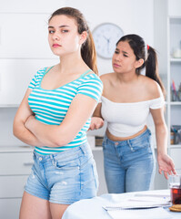 Two teenage girls squabbling at home - obrazy, fototapety, plakaty