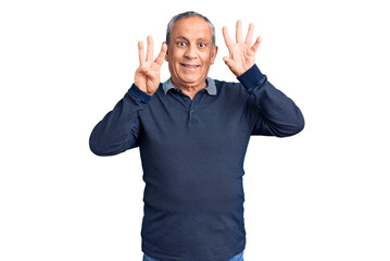 Senior handsome man wearing casual polo showing and pointing up with fingers number eight while smiling confident and happy.