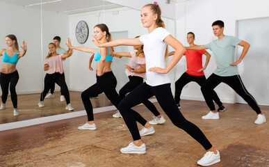 Fototapeta na wymiar Teenagers participating in dance class with teacher