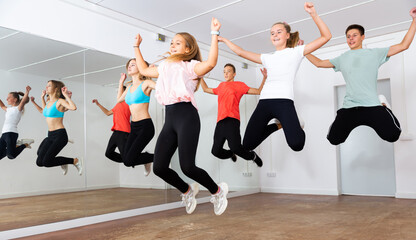 Fototapeta na wymiar Happy teens jumping in choreography class