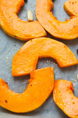 Bright slices of pumpkin prepared for baking in the oven.