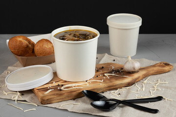 Eco packaging - soup in a craft glass for soup for a delivery service. Vegan food.