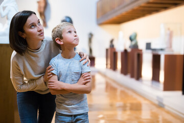Woman and boy visiting museum