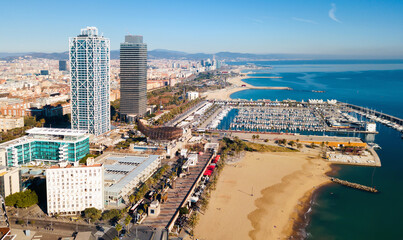 Aerial view of Barcelona with skyscrapers on coast