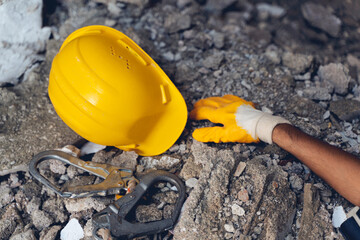 Construction worker has an accident while working on new house. Construction worker lies on the floor at the work site. Work accident