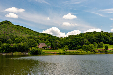 A traditional thatched roof Japanese house  preserved at a public park in Sanda, Hyogo, Japan.  