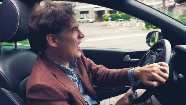 Man driving car making funny crazy expression feeling happy slow motion pro retro style