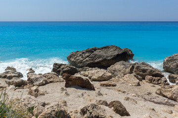 Fototapeta na wymiar blue waters and rocks of Megali Petra Beach, Lefkada, Greece