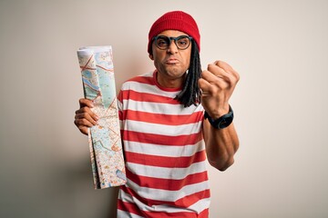 Young african american afro tourist man with dreadlocks wearing glasses holding city map annoyed and frustrated shouting with anger, crazy and yelling with raised hand, anger concept