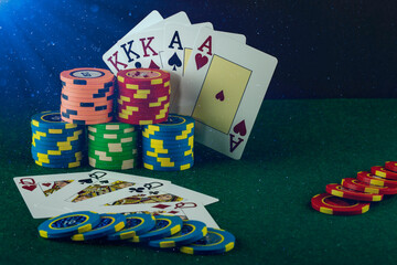 Casino game elements such as colored chips, poker cards and money
