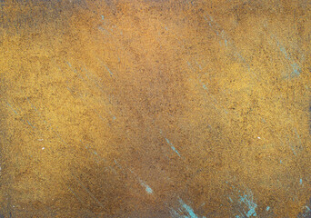 Gold colored paint with decorative texture. Decorative plaster and paint on the wall with brushed gold color.