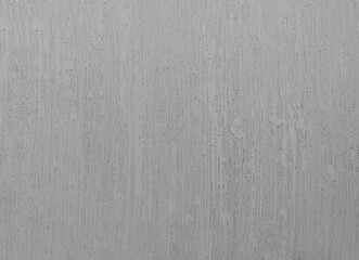 Gray background or texture. Texture of white gray wall. Abstract brush and gray textured wall plaster with a blow texture. Decorative textured paint.
