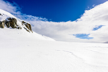 Snow rocks of the Half Moon Island, an Antarctic island, the South Shetland Islands of the Antarctic Peninsula region.