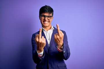 Young handsome business man wearing jacket and glasses over isolated purple background Showing...